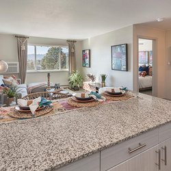 Kitchen counter with seating with view of livingroom and bedroom at North 49 Apartments, located in Colorado Springs, CO