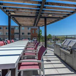 Outdoor dining area with gas grill at North 49 Apartments, located in Colorado Springs, CO 2