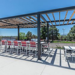Outdoor dining area with gas grill at North 49 Apartments, located in Colorado Springs, CO