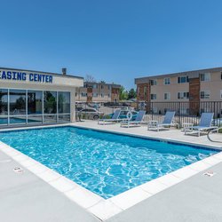 Swimming pool with lounge chairs at North 49 Apartments, located in Colorado Springs, CO 2