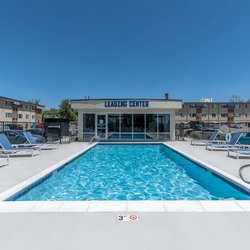 Swimming pool with lounge chairs at North 49 Apartments, located in Colorado Springs, CO 5